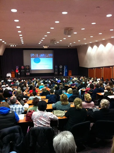 A full conference room for an event sponsored by Ocotillo Chiropractic