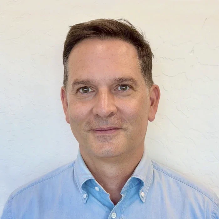 A professional headshot photo of Zsolt Egey-Samu, a chiropractor at Ocotillo Chiropractic